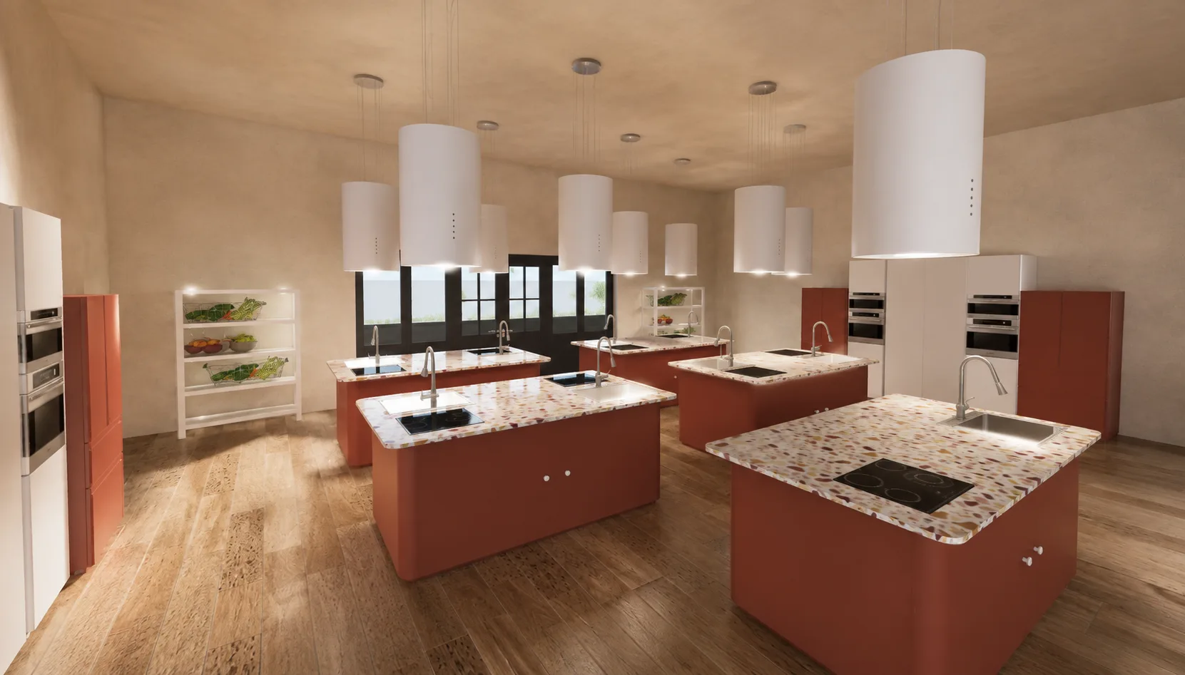 Atelier créatif avec îlots terracotta, hottes suspendues et plans de travail en terrazzo